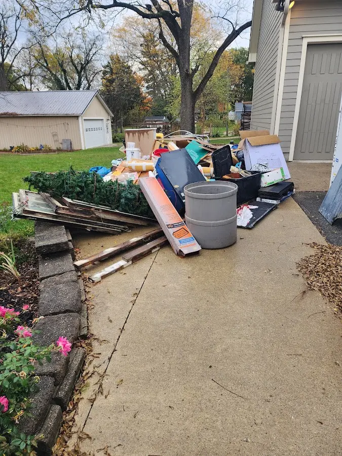 Dumpster being loaded with debris for 30 Yard Dumpster Rental in Plainfield